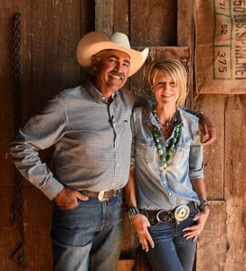 a man and a woman standing next to each other highlighting certified angus beef